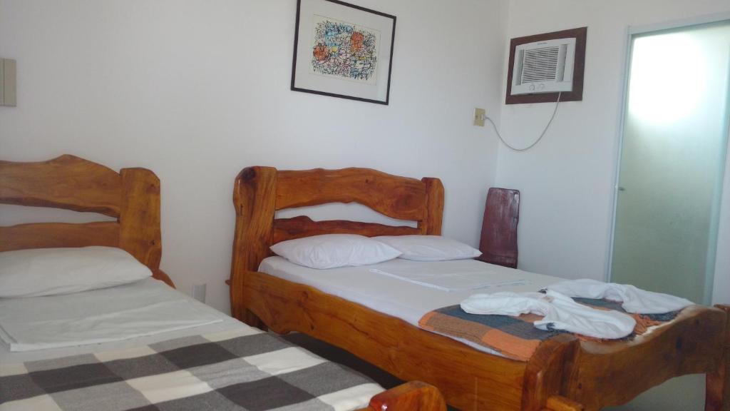 Postel nebo postele na pokoji v ubytování Hotel Portal Do Mar