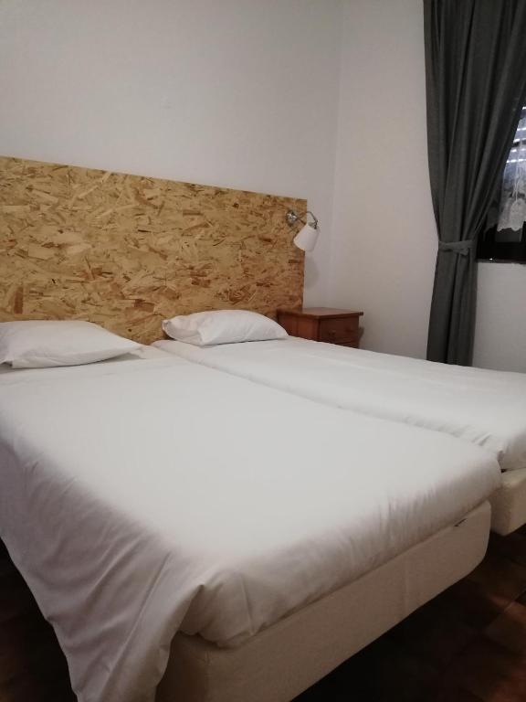 Postel nebo postele na pokoji v ubytování Hotel Eira Da Pedra