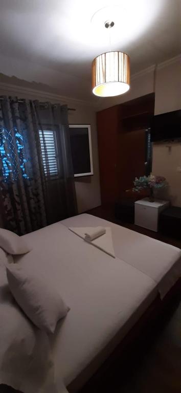 Postel nebo postele na pokoji v ubytování Hotel Bylis