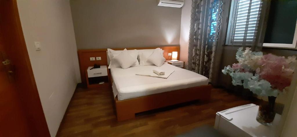 Postel nebo postele na pokoji v ubytování Hotel Bylis