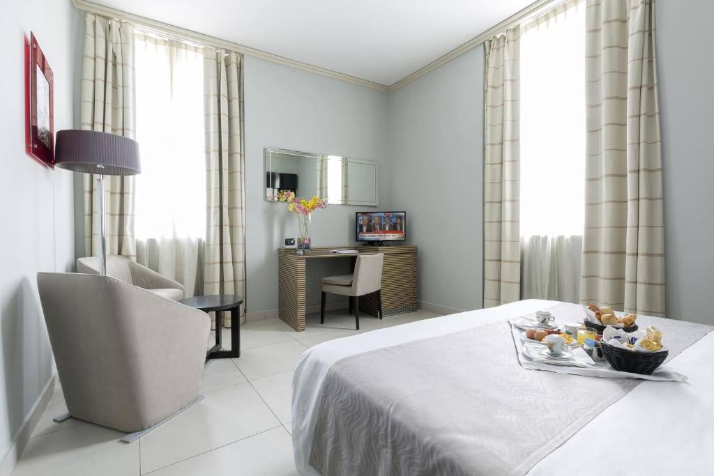 Uma cama ou camas num quarto em Palazzo Salgar