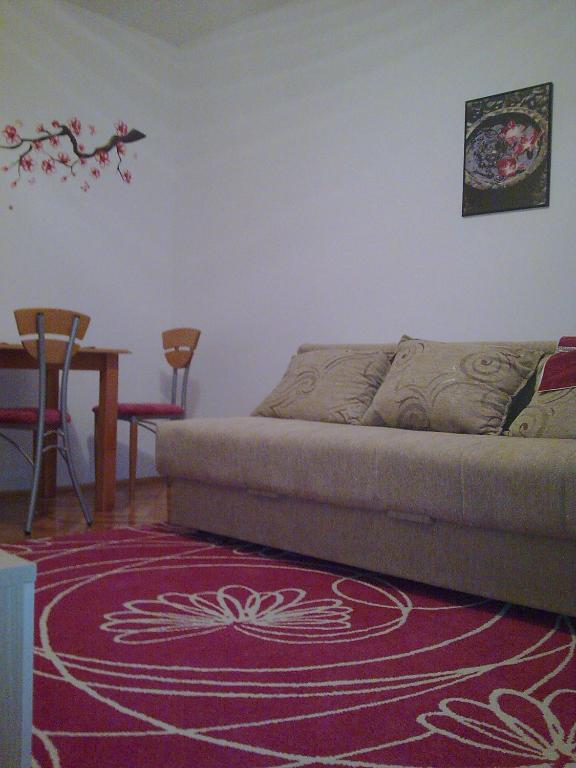a living room with a couch and a table at Sava in Soko Banja