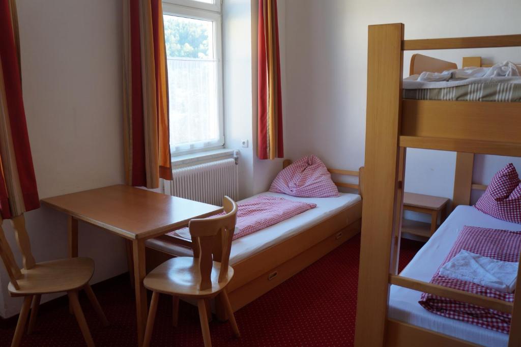 Postel nebo postele na pokoji v ubytování Luise Wehrenfennig & Haus EvA