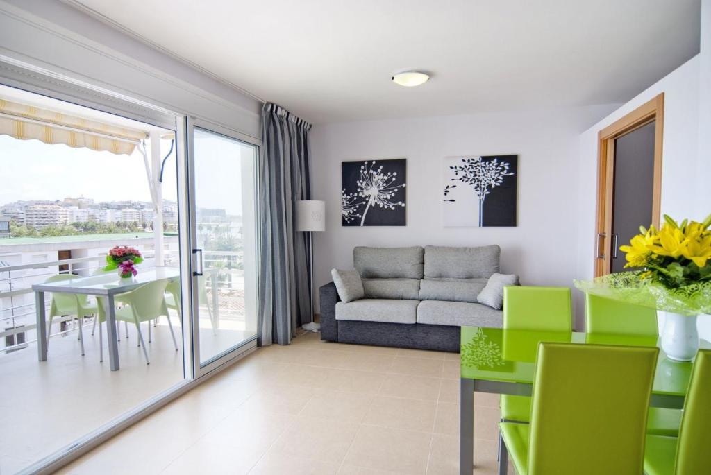 a living room with a couch and a table at Zeus Alexis Plus in Salou