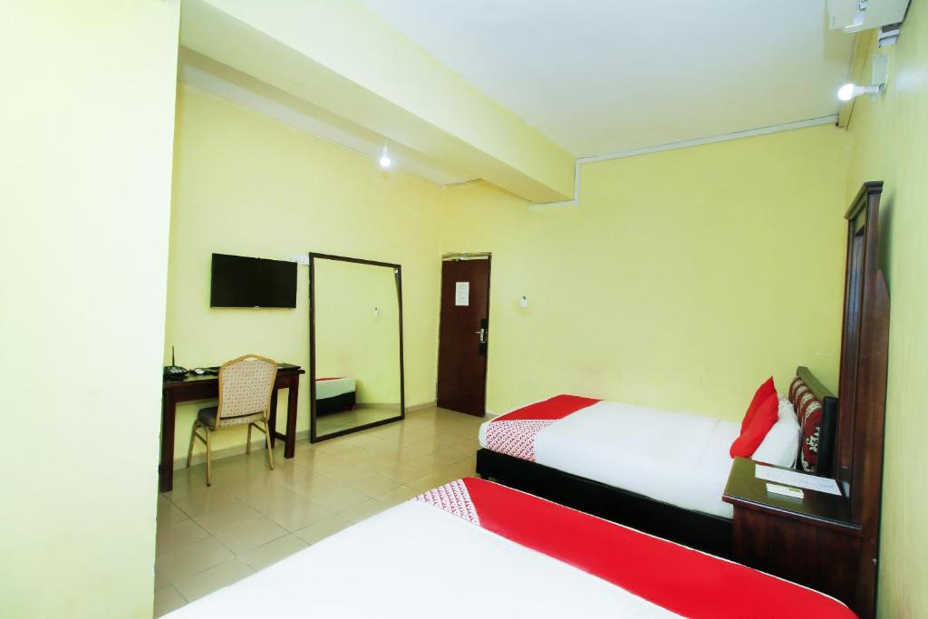 Postel nebo postele na pokoji v ubytování Green Palace Colombo