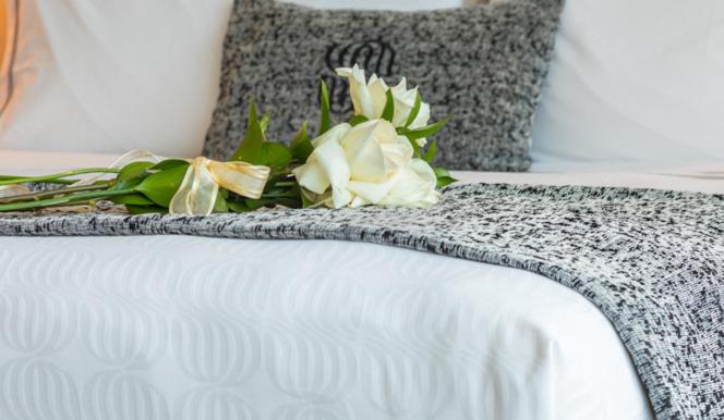 Una cama o camas en una habitación de MDS Hotel Concepción