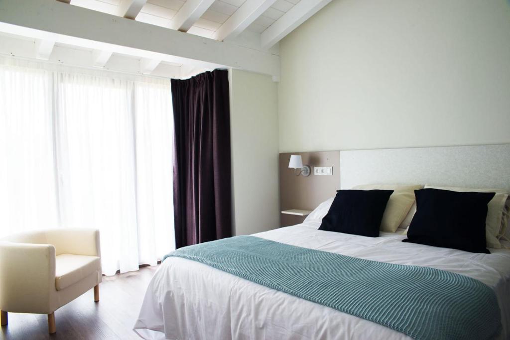 Postel nebo postele na pokoji v ubytování Apartamentos Estela de Altamira