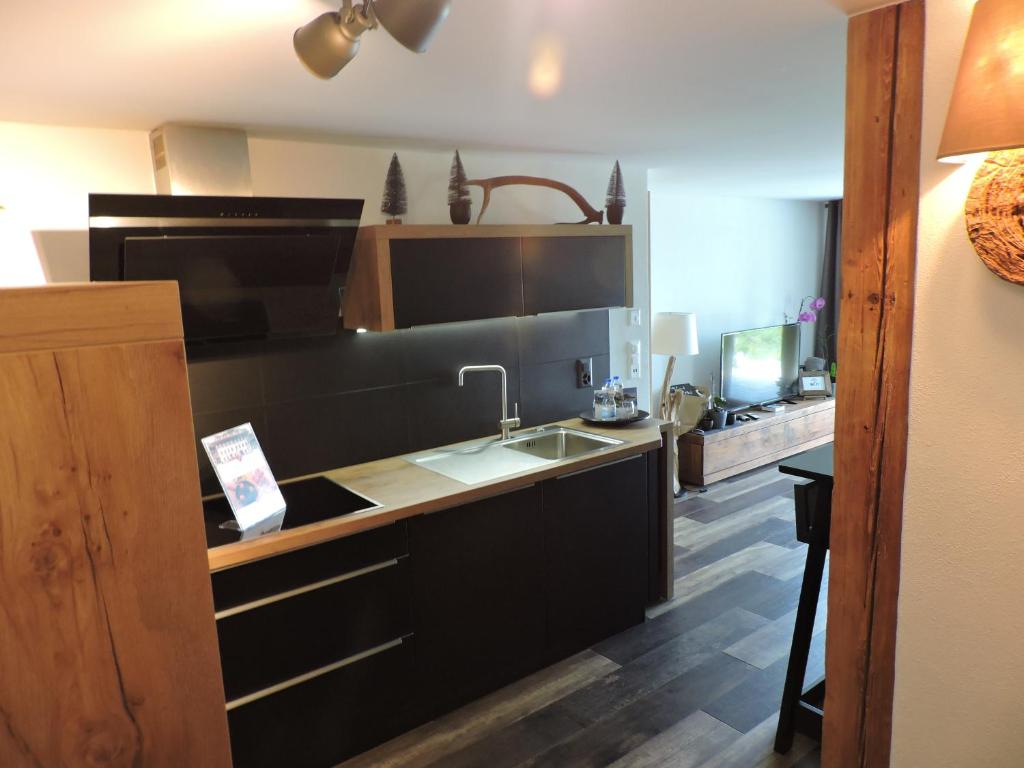 Kuchyň nebo kuchyňský kout v ubytování Chalet L'Escapade