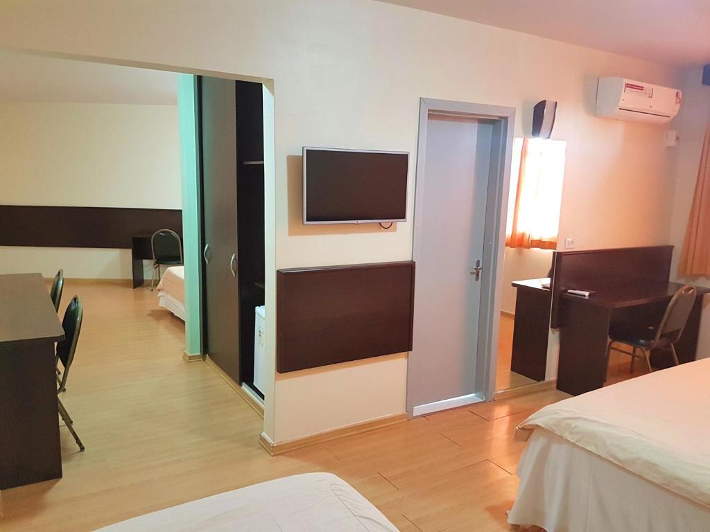Postel nebo postele na pokoji v ubytování Dom Pedro I Palace Hotel