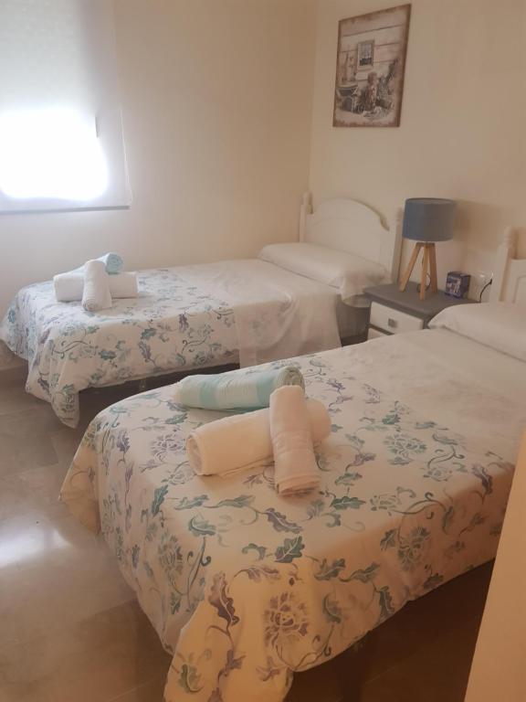 Postel nebo postele na pokoji v ubytování Casa del Sol