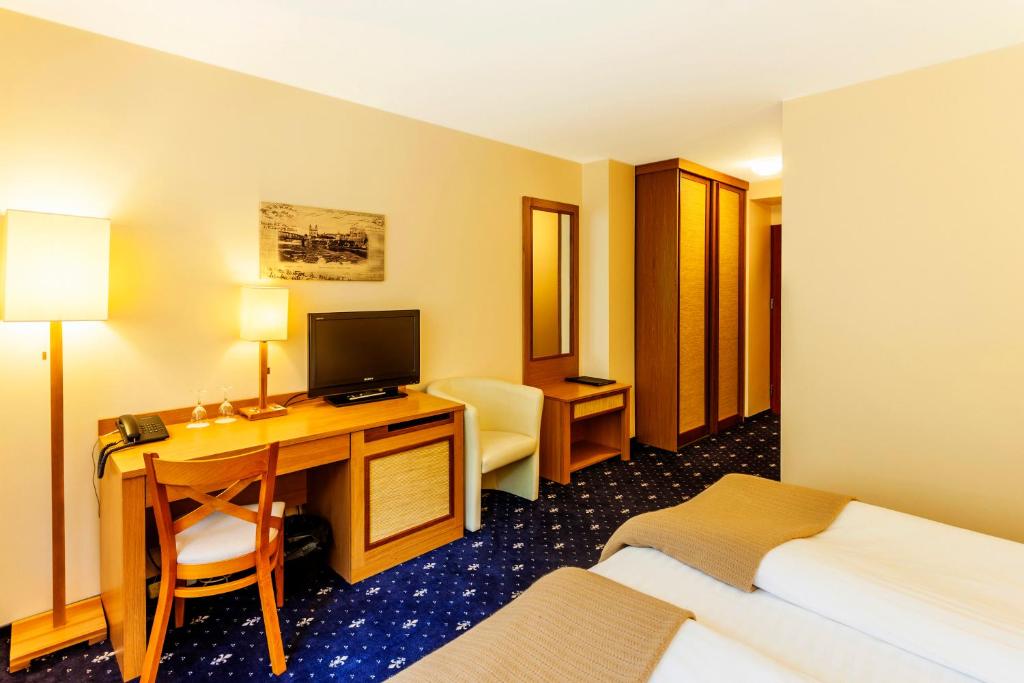 TV a/nebo společenská místnost v ubytování Park Villa Hotel