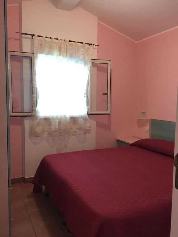 Posteľ alebo postele v izbe v ubytovaní Villa Carla