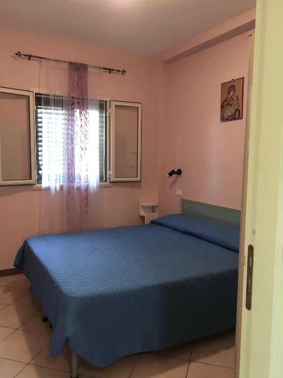 Posteľ alebo postele v izbe v ubytovaní Villa Carla