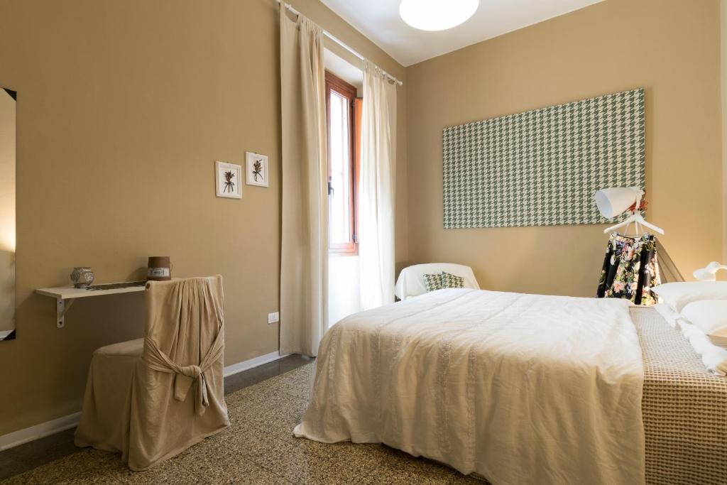 Łóżko lub łóżka w pokoju w obiekcie BluLassù City Center Rooms