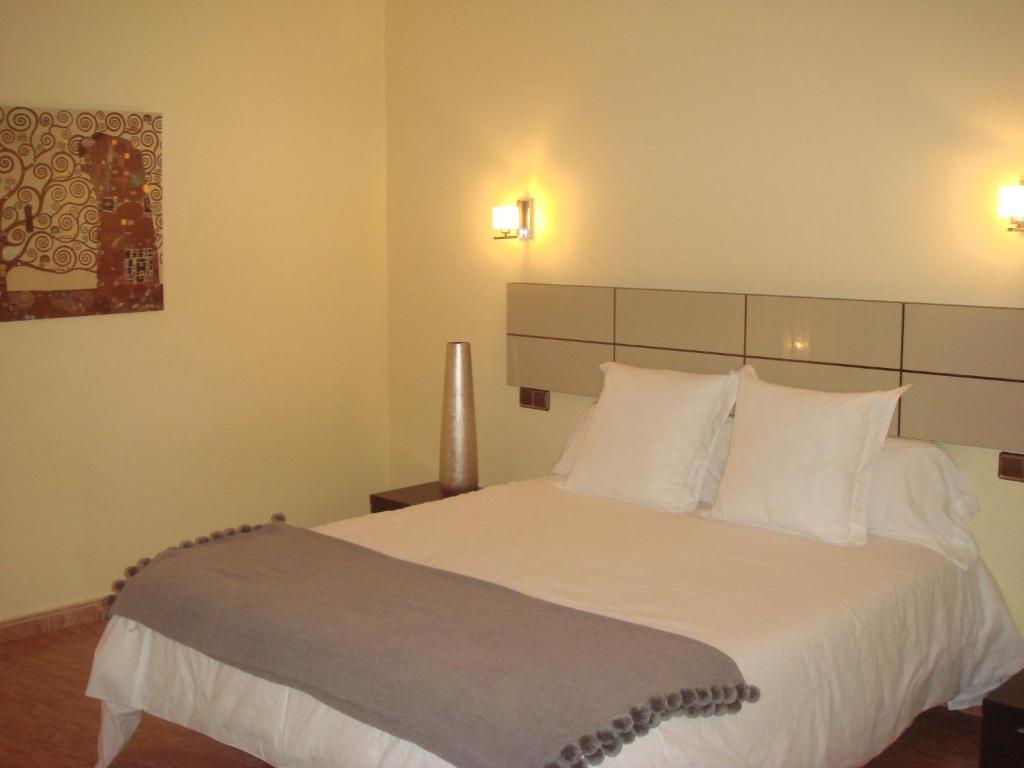 Postel nebo postele na pokoji v ubytování Hotel Oasis Familiar