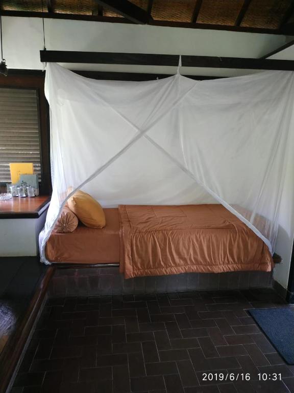 Postel nebo postele na pokoji v ubytování Ecolodge Seloliman