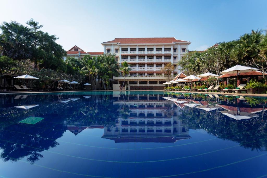 a swimming pool in front of a hotel at Royal Angkor Resort & Spa in Siem Reap