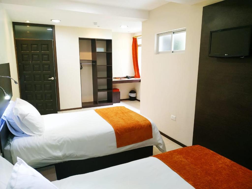 Postel nebo postele na pokoji v ubytování Monte Selva Hotel Spa Termal