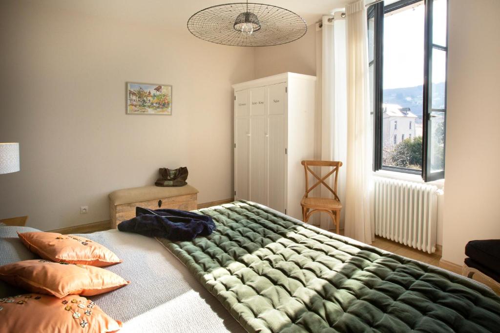 מיטה או מיטות בחדר ב-La Maison De Siloe