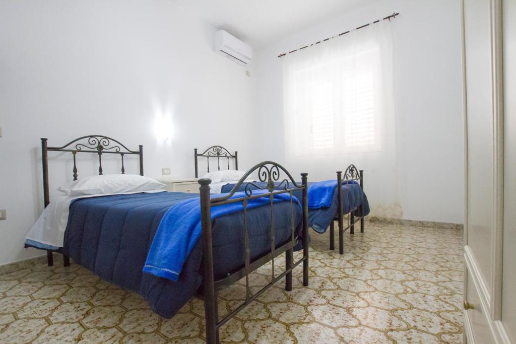 Postel nebo postele na pokoji v ubytování Le Maschere B&B