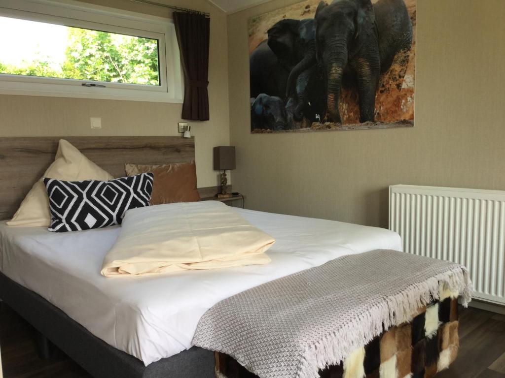 Postel nebo postele na pokoji v ubytování zu Jeddelohs Bungalows & Apartments -Adult friendly