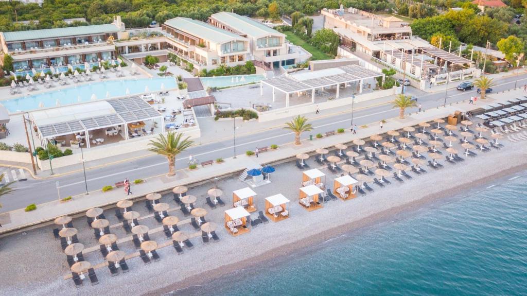 an aerial view of a resort with a beach and water at Horizon Blu Boutique Hotel in Kalamata