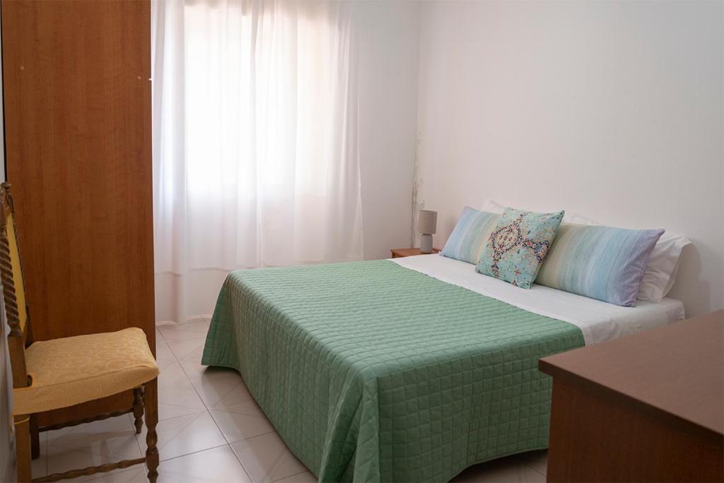 Postel nebo postele na pokoji v ubytování La Terrazza sul Mare