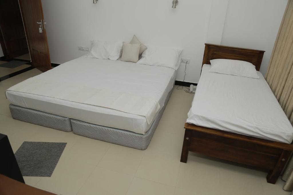 Voodi või voodid majutusasutuse Hotel Digana toas