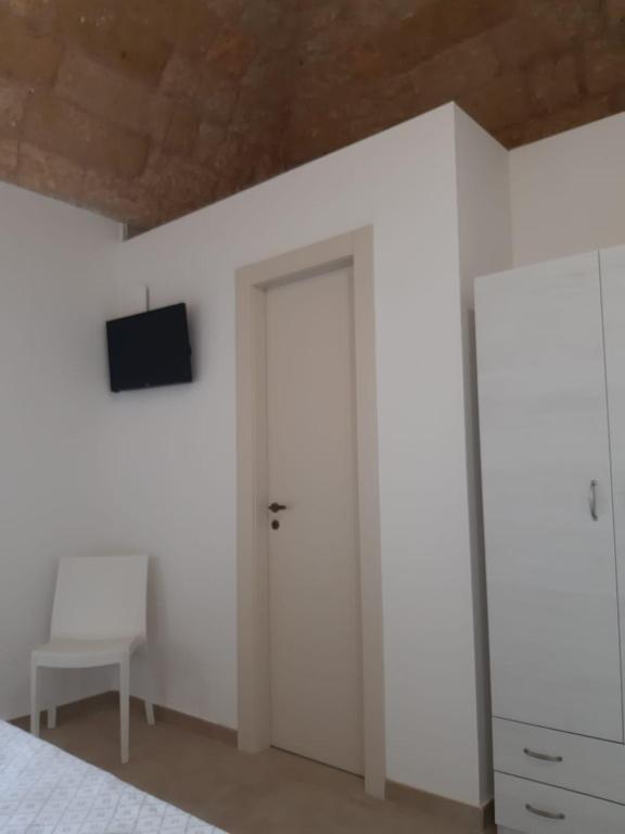 TV a/nebo společenská místnost v ubytování TORRE SUL MARE affittacamere Ugento