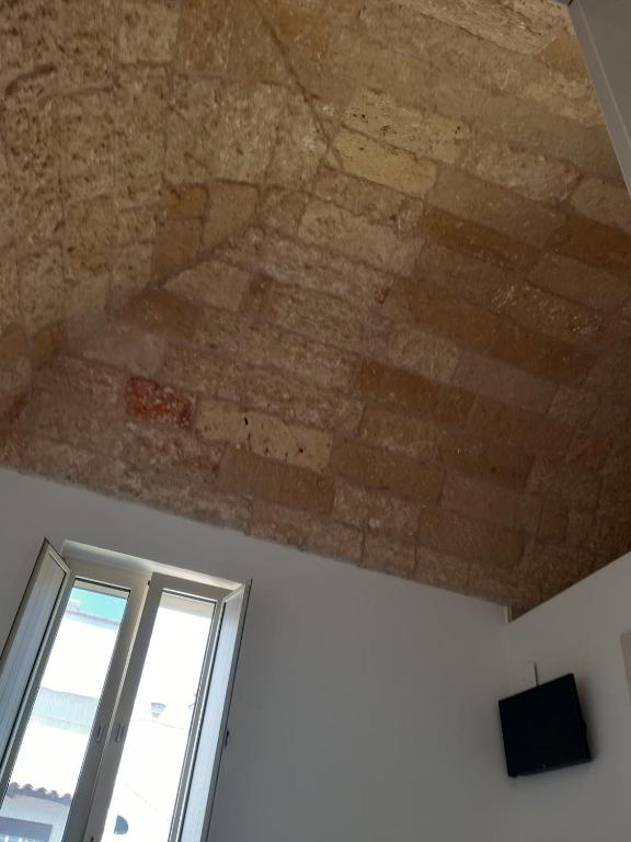 TV a/nebo společenská místnost v ubytování TORRE SUL MARE affittacamere Ugento