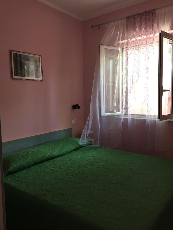 Posteľ alebo postele v izbe v ubytovaní Villa Carla