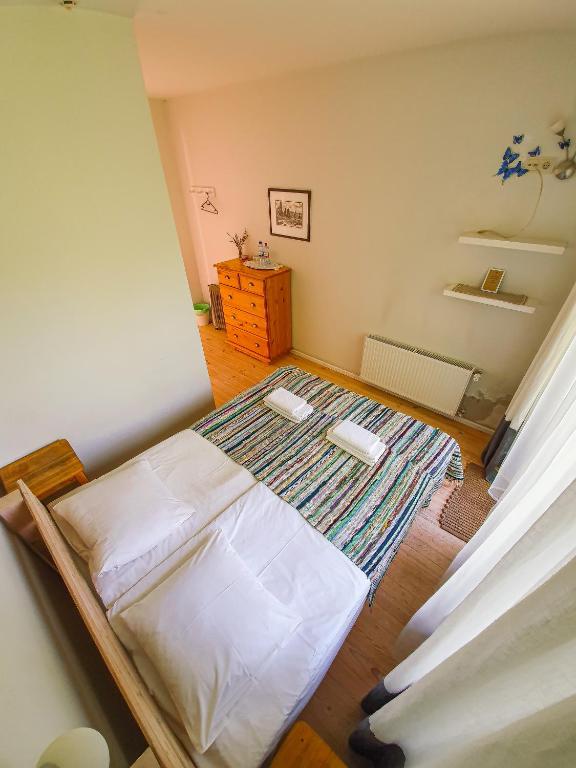 Postel nebo postele na pokoji v ubytování Mazā Kāpa