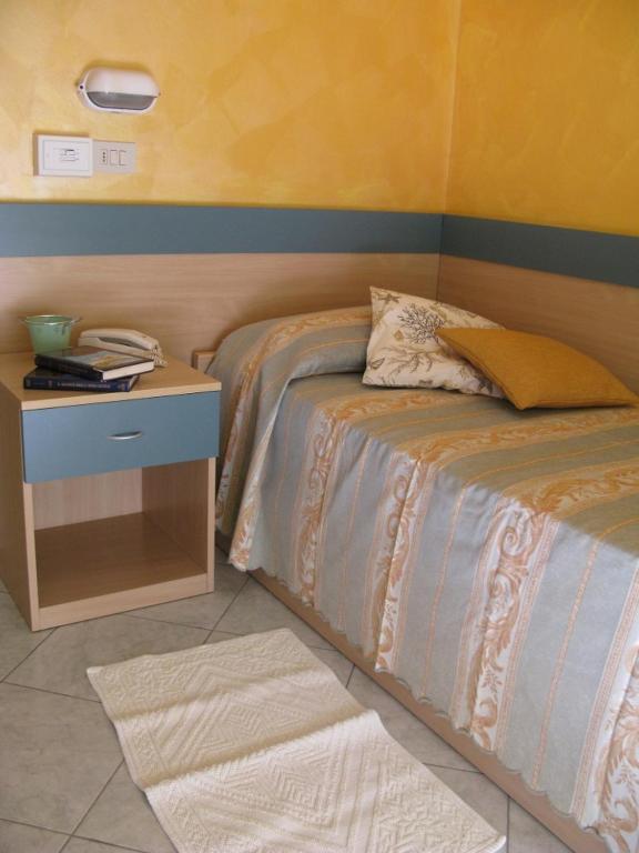 Postel nebo postele na pokoji v ubytování Hotel Solidea