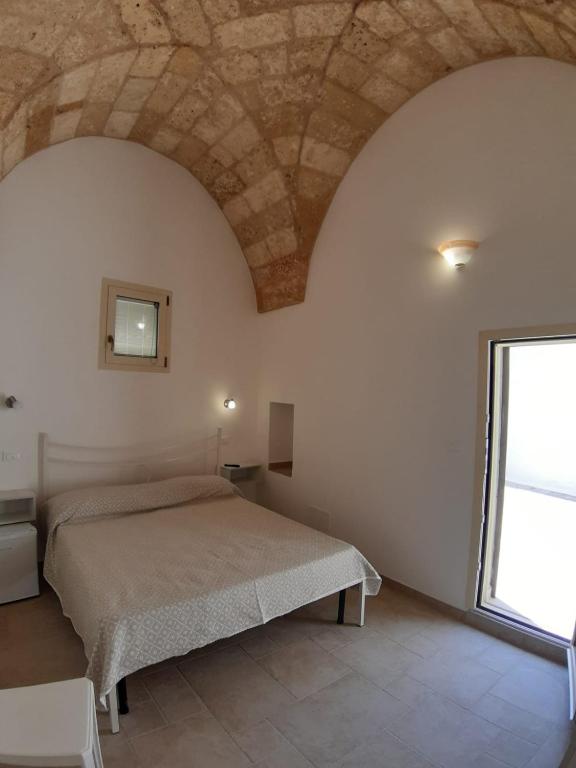 Postel nebo postele na pokoji v ubytování TORRE SUL MARE affittacamere Ugento