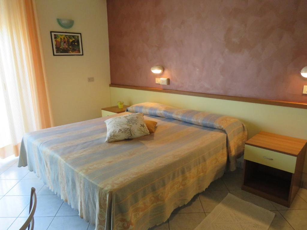 Postel nebo postele na pokoji v ubytování Hotel Solidea