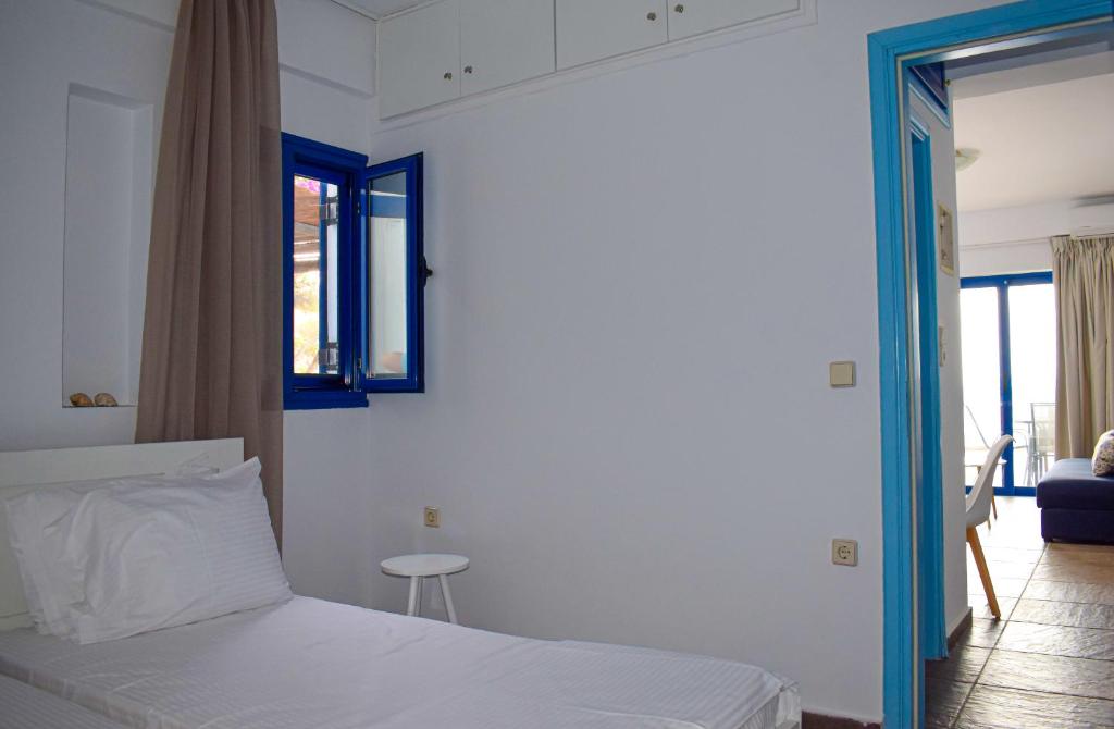 A bed or beds in a room at Muses seaside Villas