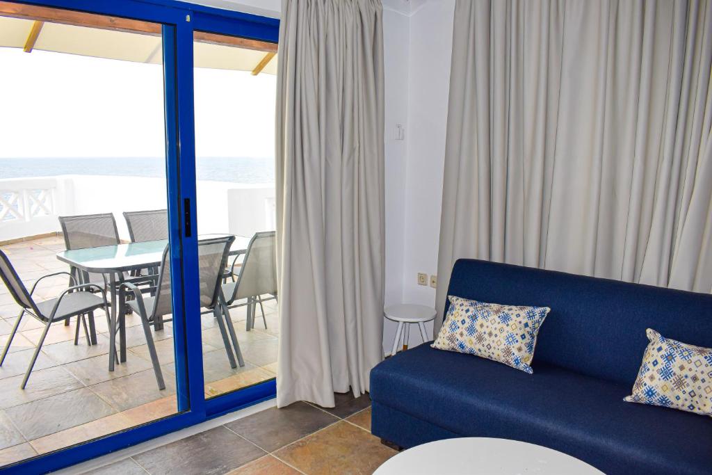 A seating area at Muses seaside Villas