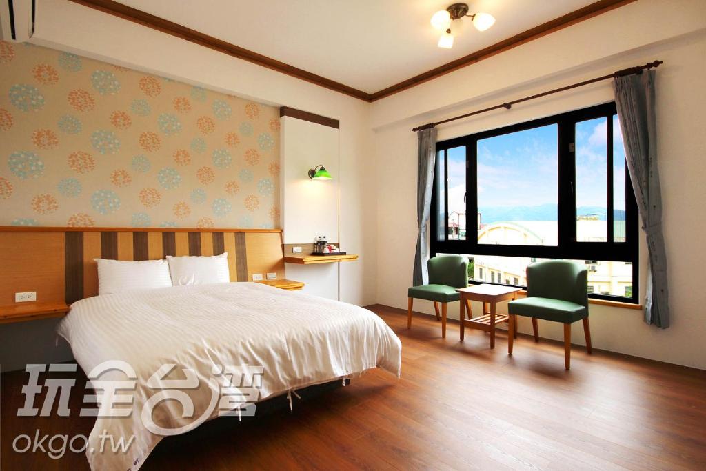 Postel nebo postele na pokoji v ubytování Do Tian Ding B&B