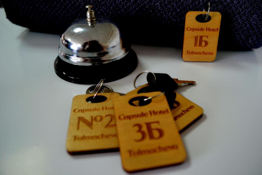 a group of tags with numbers on them at Capsule Hotel Tolmachevo in Ob