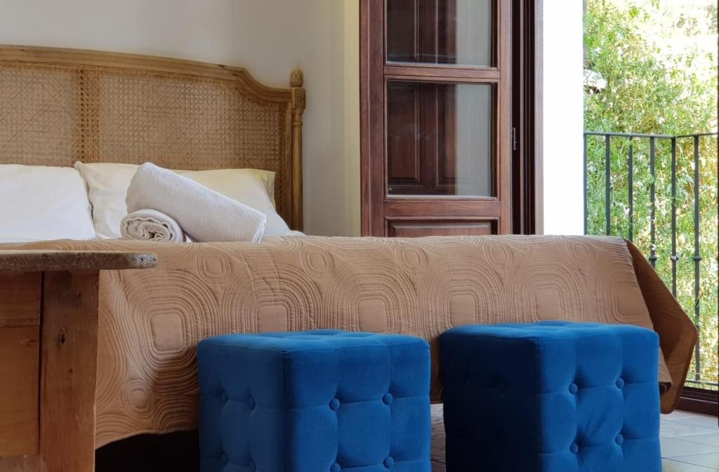 A bed or beds in a room at Casa Mirador Alhambra