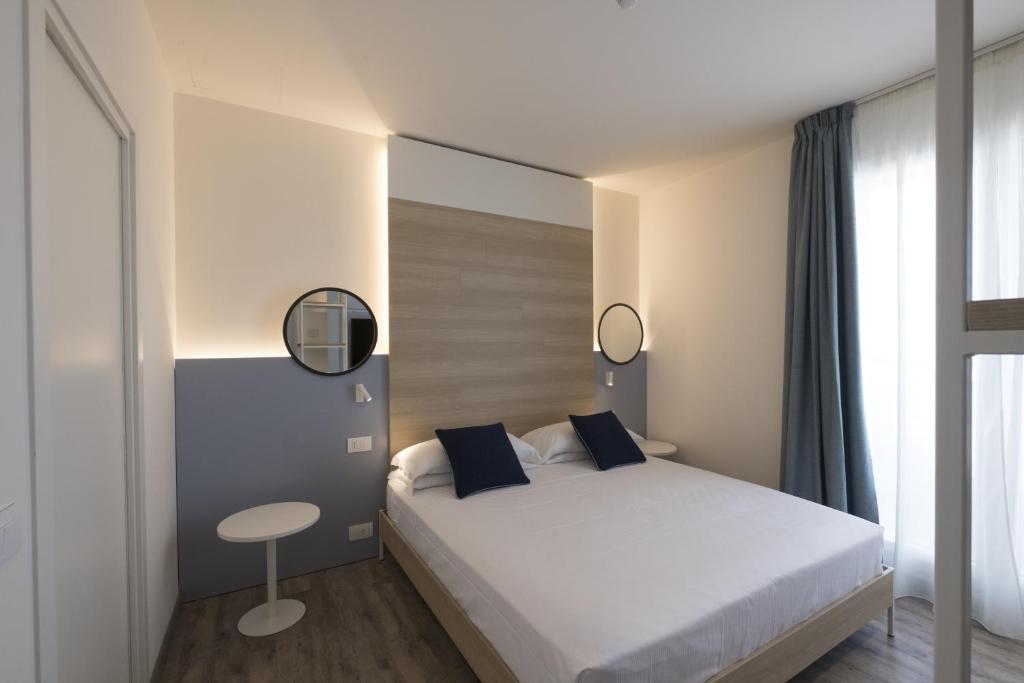 Postel nebo postele na pokoji v ubytování Hotel Baia
