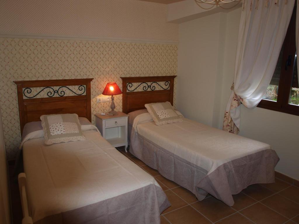 Postel nebo postele na pokoji v ubytování Casa Gallán