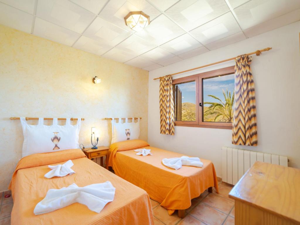 Postel nebo postele na pokoji v ubytování Villa Cala Torta Na Lluny by Interhome