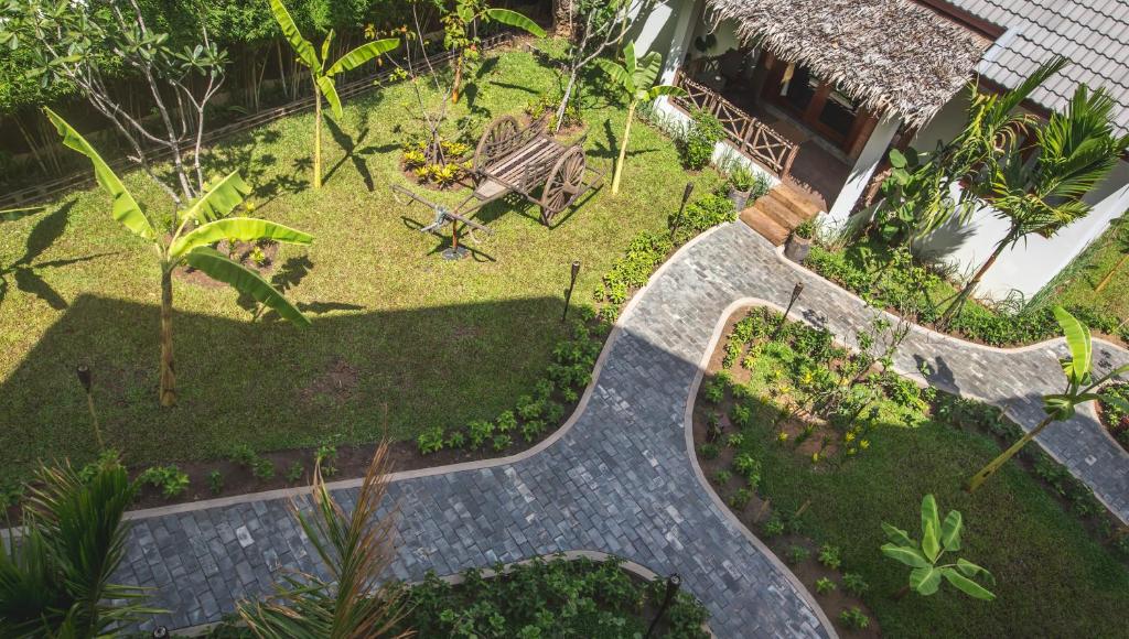 an overhead view of a garden with a walkway at La Rivière d' Angkor Resort in Siem Reap