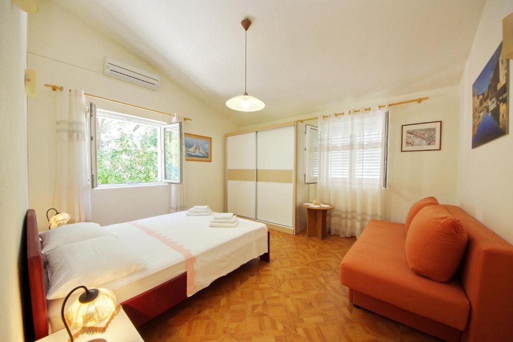 Posteľ alebo postele v izbe v ubytovaní Apartments Villa Hraste Hvar