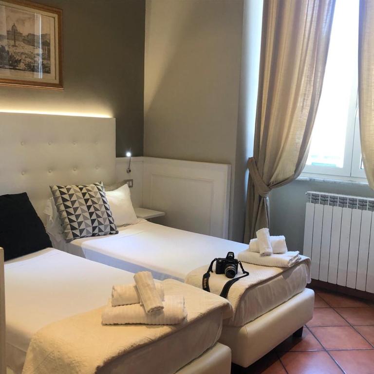 A bed or beds in a room at 207 Inn