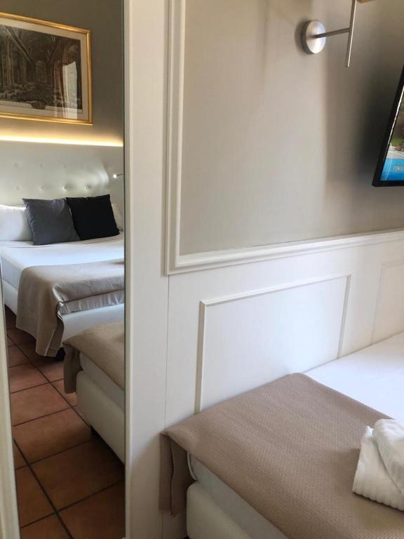 A bed or beds in a room at 207 Inn