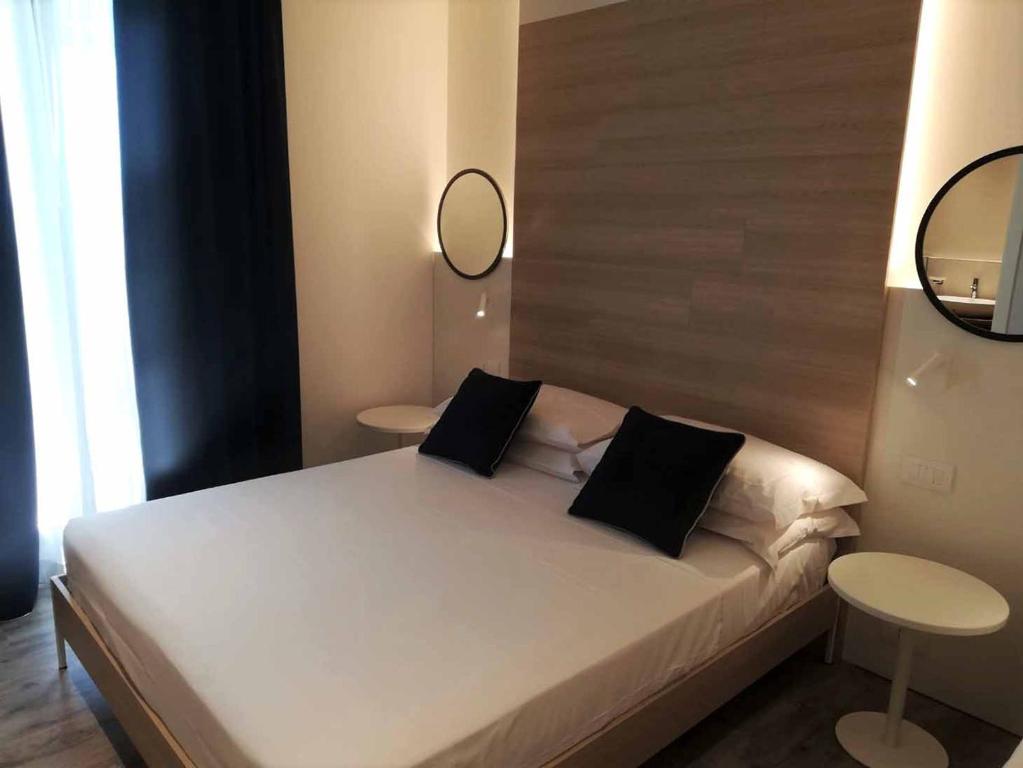 Postel nebo postele na pokoji v ubytování Hotel Baia