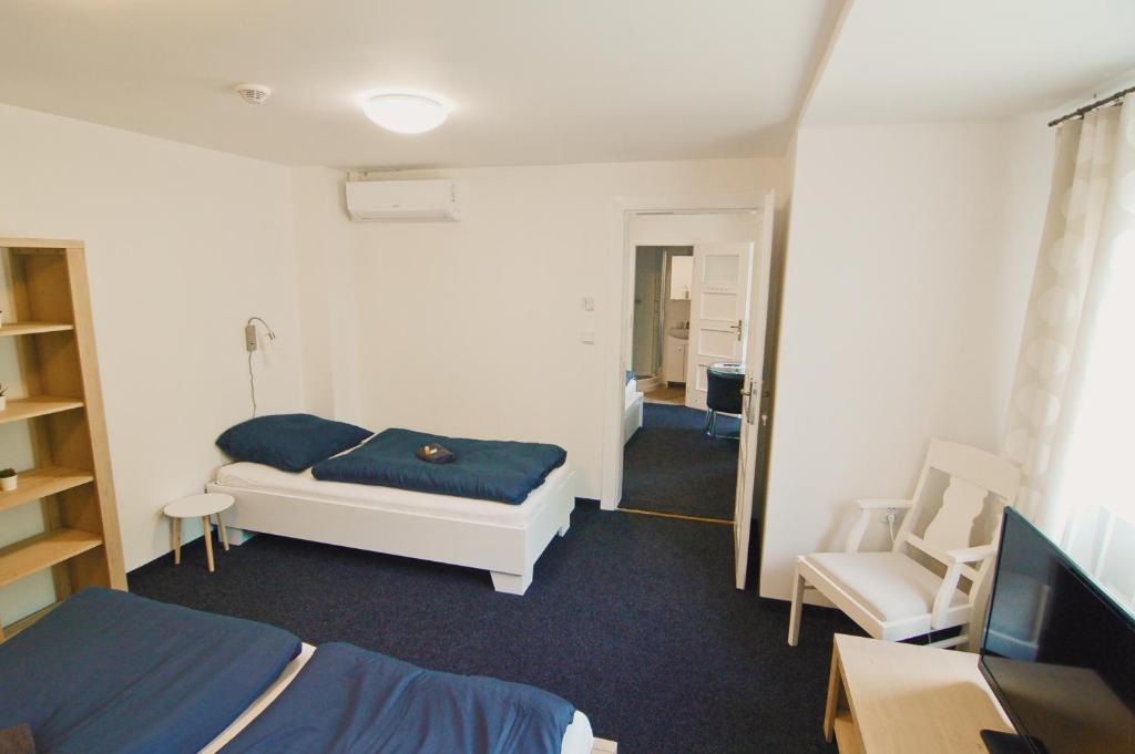 Postel nebo postele na pokoji v ubytování APARTHOTEL VÍTKOVICE