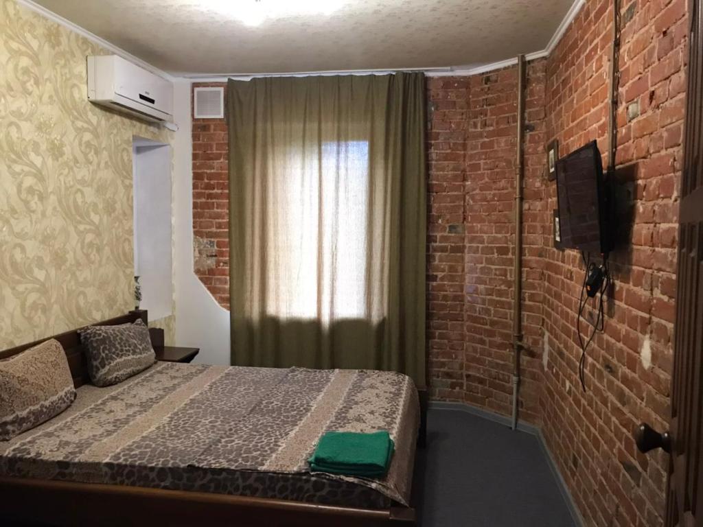 Postel nebo postele na pokoji v ubytování Moskovs'kyi Avenue 41